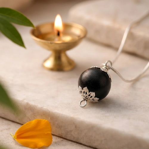12mm Karungali Guru Bead with silver plated chain by Saadhak for grounding, protection, and everyday spiritual wear.