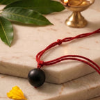 Karungali bead with silver plated cap by Saadhak for grounding, protection, positive energy, and everyday spiritual wear.