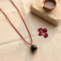 Karungali bead with silver plated cap by Saadhak for grounding, protection, positive energy, and everyday spiritual wear.