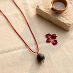 Karungali bead with silver plated cap by Saadhak for grounding, protection, positive energy, and everyday spiritual wear.