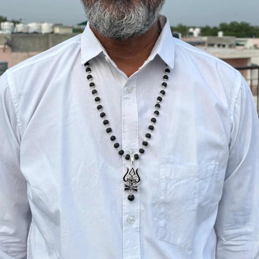 Karungali mala by Saadhak with black Trishul pendant for protection, grounding, spiritual strength, and everyday devotional wear.