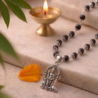 Karungali Murugan mala by Saadhak with sacred beads and Lord Murugan pendant for protection, strength, and spiritual wear.