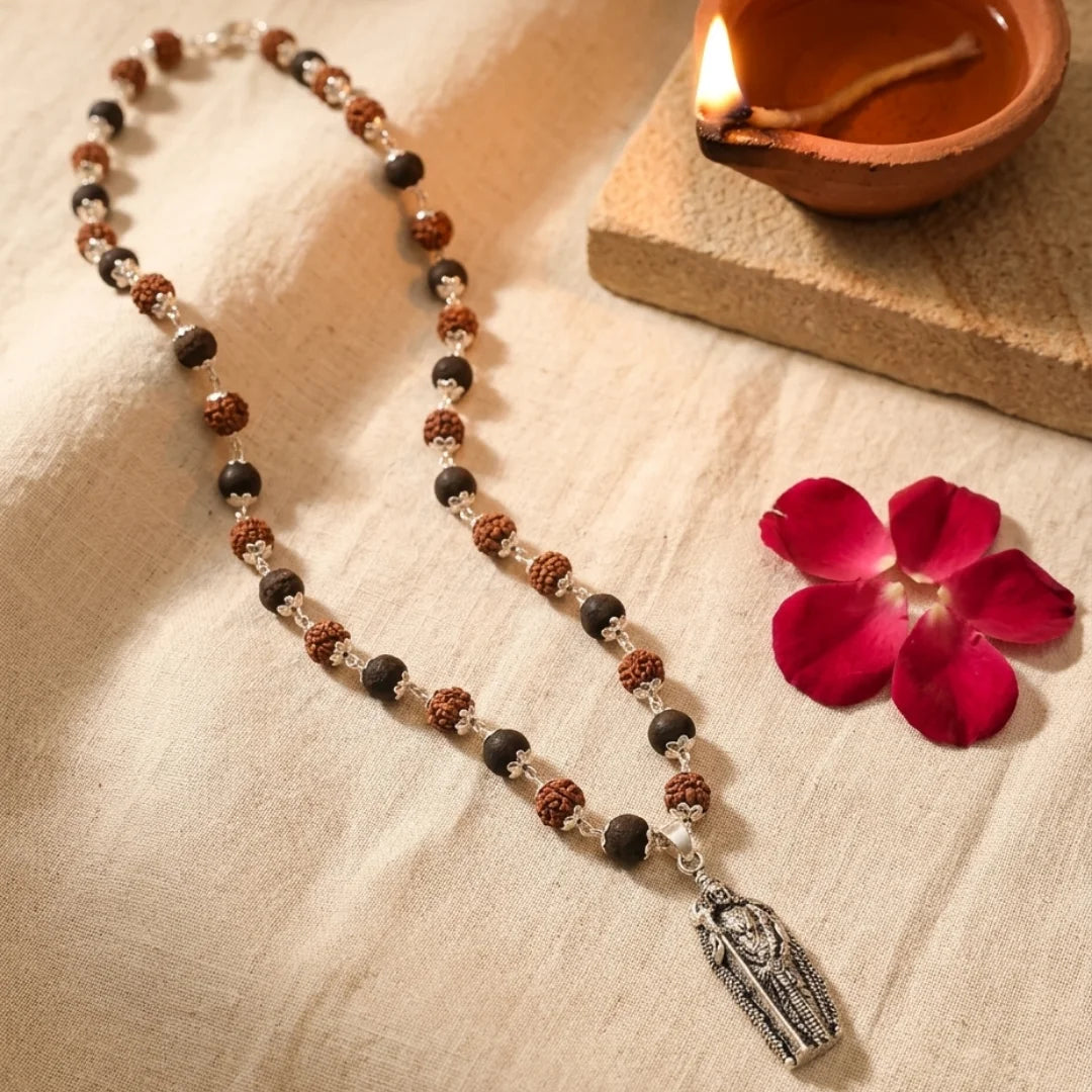 Karungali & Rudraksha silver capped mala by Saadhak with Lord Murugan pendant for protection, strength, and spiritual wear.