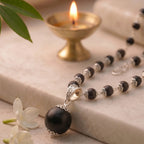 Karungali silver cap mala by Saadhak with 12mm Guru Bead for grounding, protection, spiritual balance, and daily wear.