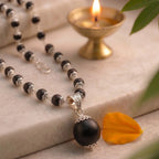 Karungali silver cap mala by Saadhak with 12mm Guru Bead for grounding, protection, spiritual balance, and daily wear.