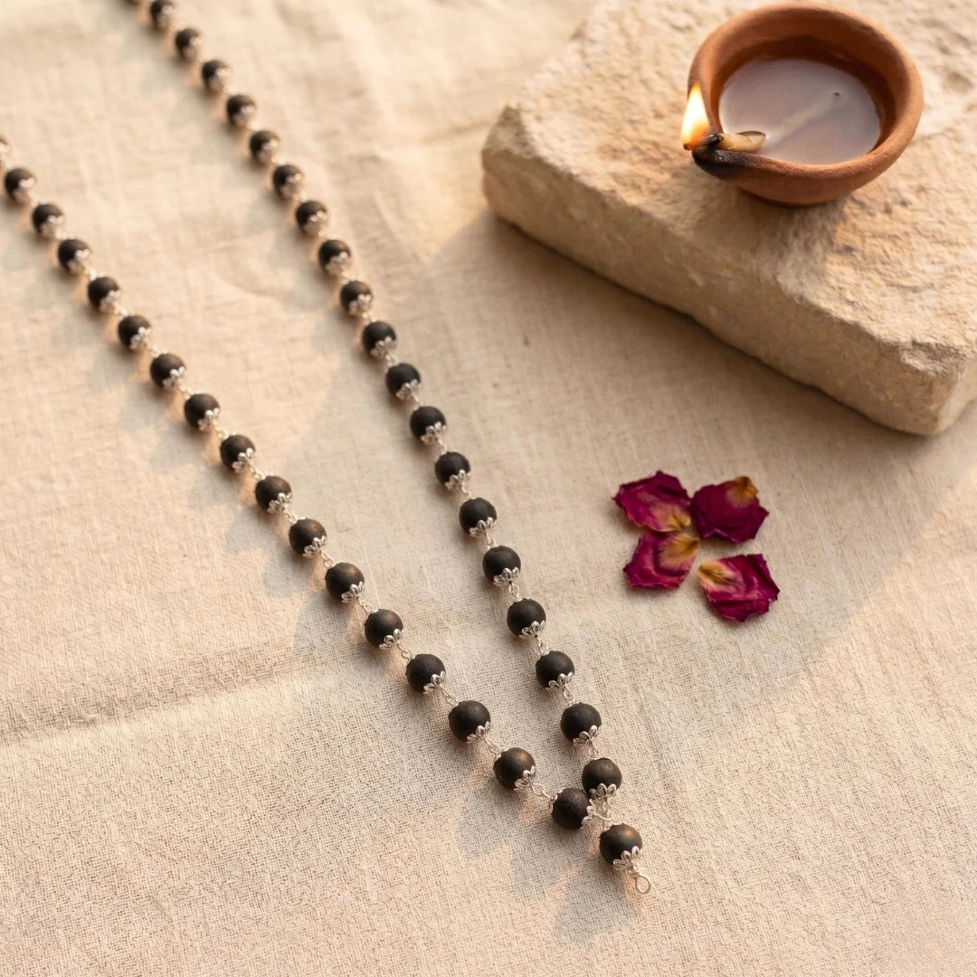 Karungali silver capped mala by Saadhak crafted for grounding, protection, spiritual balance, and everyday devotional wear.