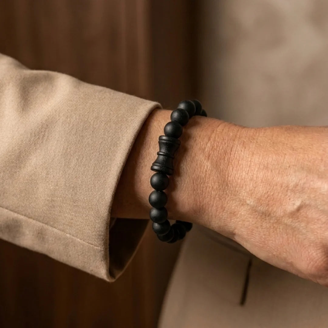 Handcrafted Karungali Damru bracelet by Saadhak featuring authentic ebony wood beads and a sacred Damru charm.