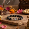 Handcrafted Lava and Trishul Silver Cap bracelet by Saadhak featuring natural lava stone beads and a Trishul charm.