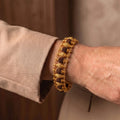 Handcrafted Rudraksha Gold Plated bracelet by Saadhak featuring authentic Rudraksha beads with gold-plated accents.