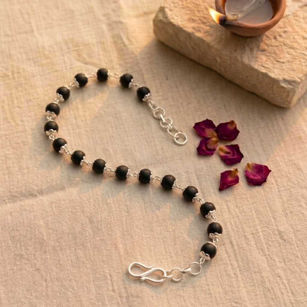 Handcrafted Silver Capped Karungali bracelet by Saadhak featuring authentic ebony wood beads with silver-capped accents.