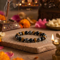 Handcrafted Triple Protection bracelet by Saadhak featuring natural Tiger Eye, Black Onyx, and Hematite gemstone beads.