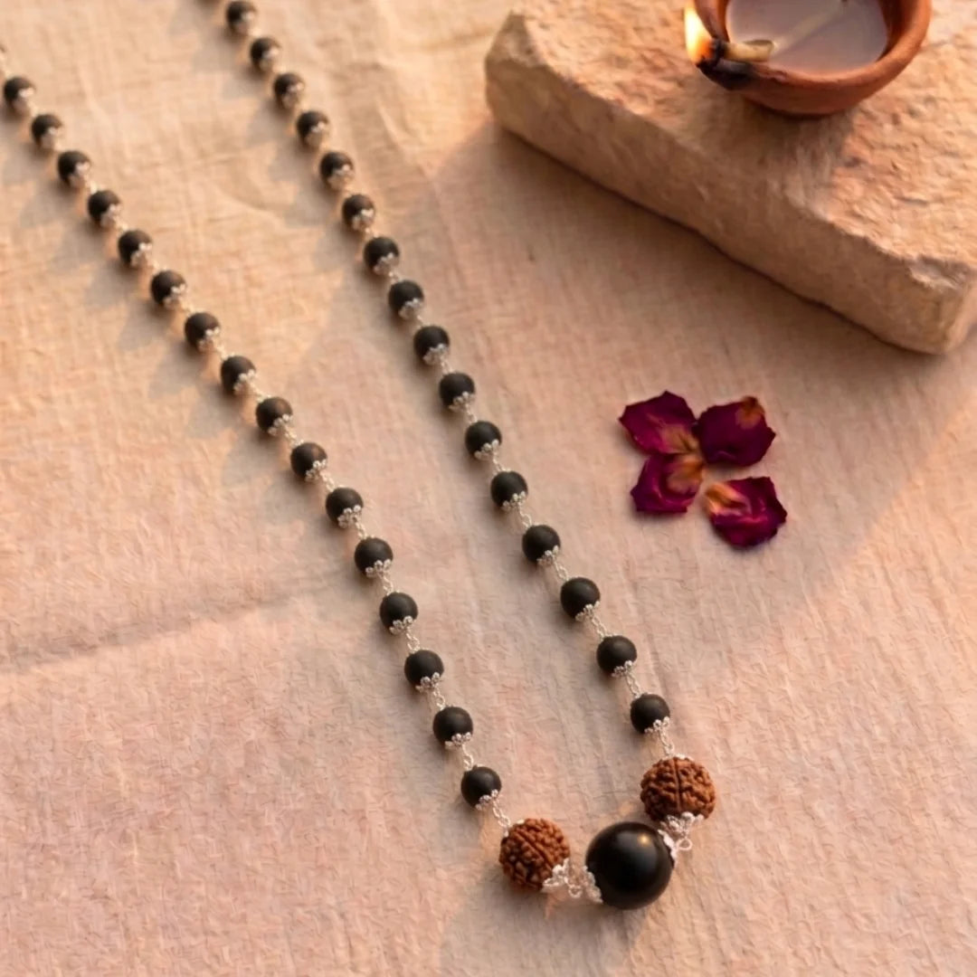 Silver capped Karungali Malai by Saadhak with 6 Mukhi Rudraksha for protection, balance, spiritual growth, and daily wear.