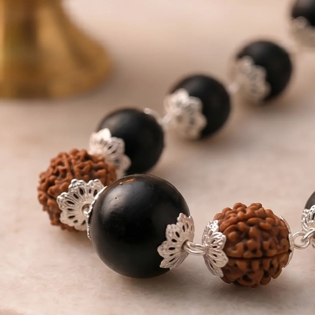 Silver capped Karungali Malai by Saadhak with 6 Mukhi Rudraksha for protection, balance, spiritual growth, and daily wear.